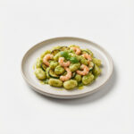 Gnocchi pesto zucchine scampi
